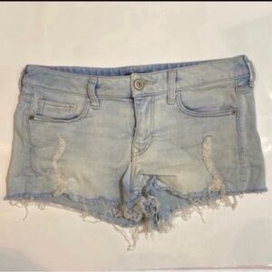 Express ultimate stretch shortie low rise light denim distressed cut off shorts